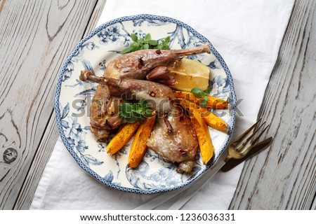 Roasted guinea fowl with pumpkin, lemon, hot pepper, garlic, and basil