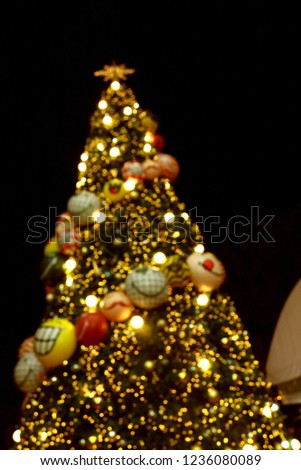 Abstract circular bokeh background of Christmaslight and Chriistmas tree