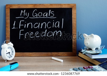 My goals and financial freedom written on a blackboard. Royalty-Free Stock Photo #1236087769