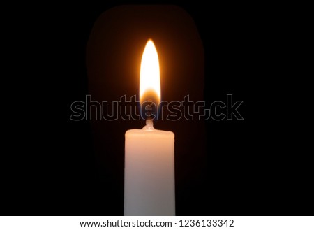 Burning white candle 