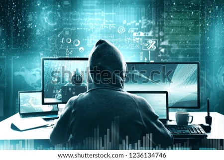 Computing and criminal concept. Hacker using computer with digital business interface