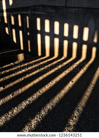 Light and shadow behind Chanel of the  fence on the sunset time in autumn seasons at japan