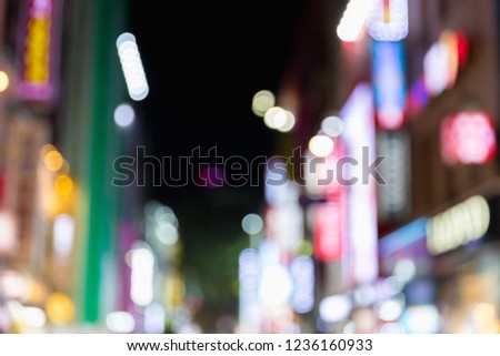Blurred Colorful billboards in Myeongdong street market at night in Seoul, South Korea.
