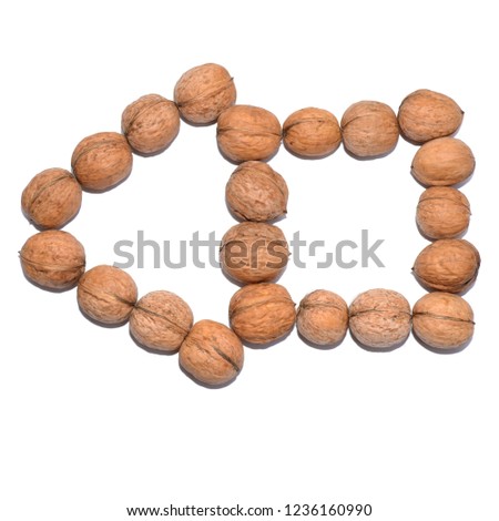 Arrow pointer. Arrow symbol composed of nuts isolated on white background.
