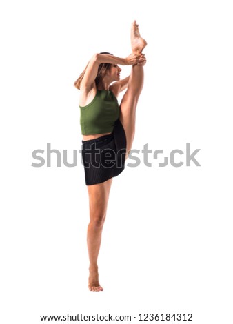 Young girl dancing in studio on isolated background