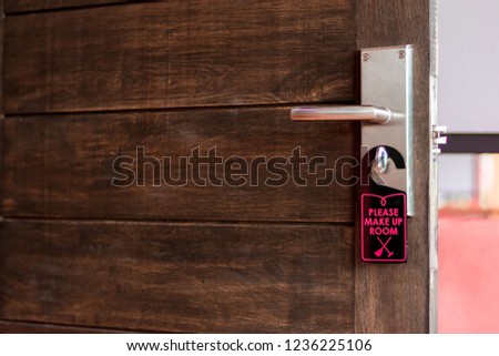 Wooden doors and cleaning signs