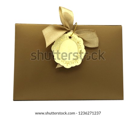 Golden triangular gift box isolated on white background with clipping path