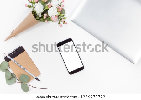 Top view of mockup of laptop, mobile phone. Flat lay of workspace