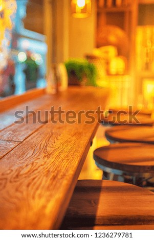 Picture of cafe interior with wooden table and chairs