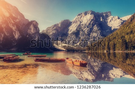 Wonderful Nature Landscape in Sunny day. Awesome Natural Background with mountain lake Baies. Very popular Travel destination in Dolomites Alps. Italy, Europe, Instagram style. Amazing summer scene.