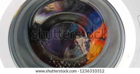 Washing machine in operation Royalty-Free Stock Photo #1236310312