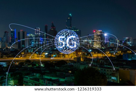 5G network wireless systems and internet of things on city night background.concept of future technology.