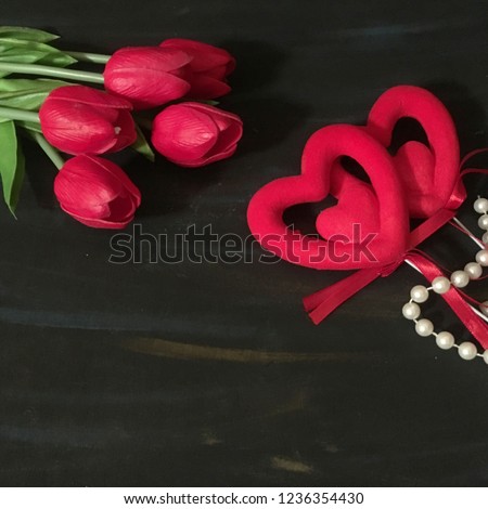 Valentine's day background with red heart ,pearls and red tulips