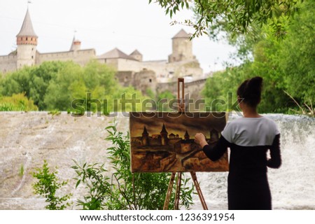 The artist paints a fortress at work. which is located on the territory of Ukraine