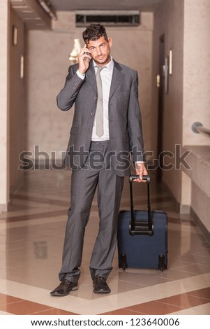 Businessman ready to Depart with Trolley