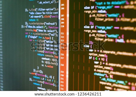 IT coding on monitor screen. Binary digits code editing. New technology revolution. Abstract IT technology background.  PHP syntax highlighted. PC software creation business. 