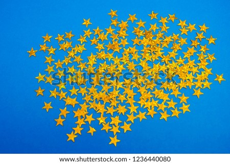 Many Random Falling Yellow Stars Confetti on Blue Background. Invitation Design. Banner, Greeting Card, Christmas card, Postcard, Packaging, Textile Print. Beautiful Night Sky.