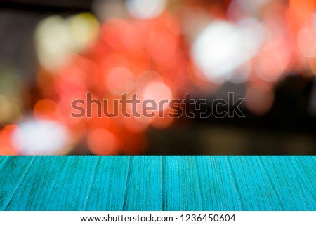 The blue wood floor and red color,dark bokeh background.