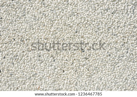 small rock or stones on wall, background of grey