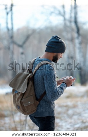 Professional nature photographer outdoor in the winter forest