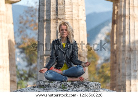 Woman Meditating at the Ancient Greek Temple of Athena in Italy