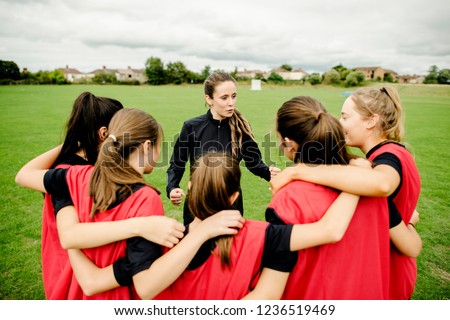 Rugby players and their coach gathering before a match Royalty-Free Stock Photo #1236519469