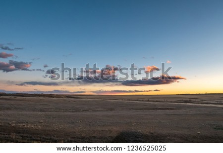 Sunset Solor Clouds Over The Colorado Flat Lands