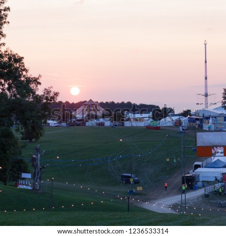 The sun sets on tents and marquees at a music festival