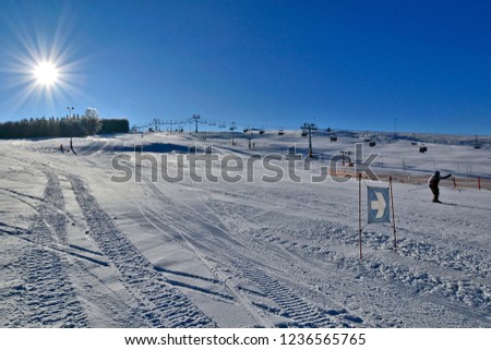 Slope on the skiing resort  - winter sunny day in Tylicz village, Poland Royalty-Free Stock Photo #1236565765