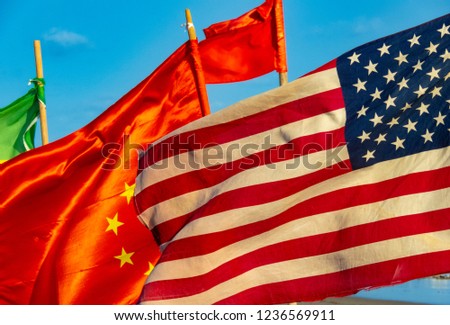 Usa and china flags on the beach in Accra.