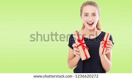 Beautiful pretty casual caucasian girl holding presents in boxes, holidays