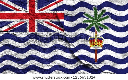 Flag of British Territory in the Indian Ocean close up painted on a cracked wall, concept of armed actions and conflicts in the world