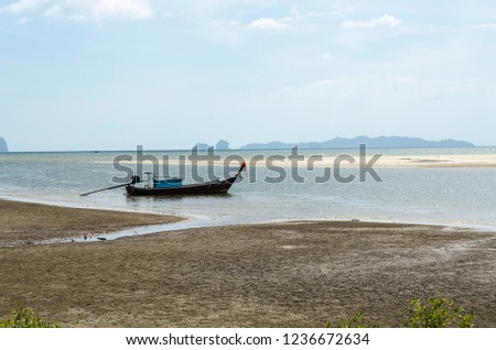 Blue water beach, sea and sand, beautiful sky and clouds,mountain, boat