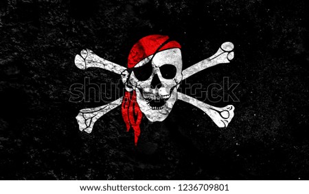 Flag of pirate close up painted on a cracked wall, concept of armed actions and conflicts in the world