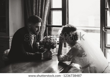Wedding couple, groom and bride, together in a restaurant on wedding day