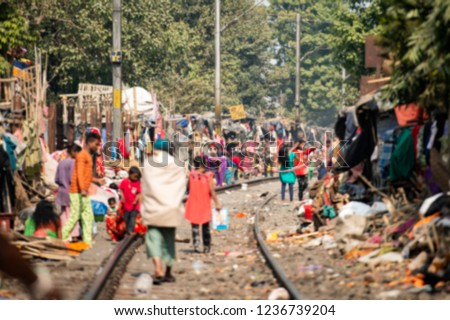 Blurred picture of daily life of poor people in a slum in Kolkata. In Kolkata there are over 70,000 people who are homeless and almost one-third of the total population live in slums.