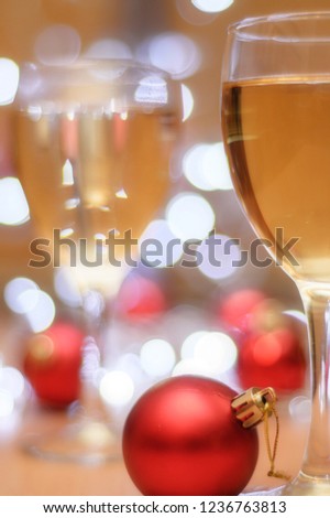 glasses with champagne on the background of Christmas lights
