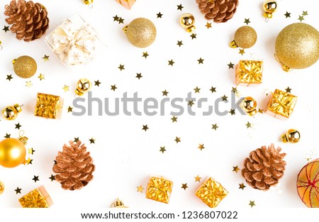 Christmas composition. Christmas golden decor, pine cone, star on white background. Flat lay, top view, copy space