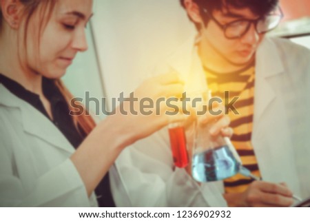 Blurred photo Two young scientists researched in vitro experiments discovered in science and education labs. 