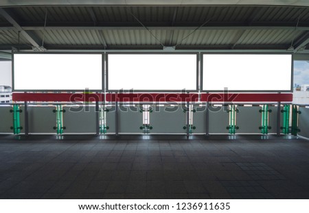 billboard big blank white three LED screen horizontal outstanding at side way people walking on sky train for display advertisement text template promotion new brand indoor.