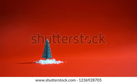 Top view snowy christmas tree with snow on the ground on red background. Minimal New Year concept. Flat lay