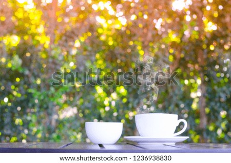 Cup of coffee on table in cafe ,Morning time ,morning light.