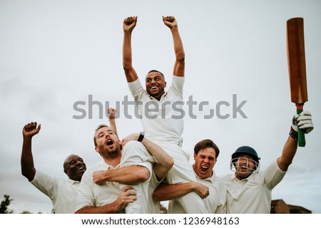 Cheerful cricketers celebrating their victory