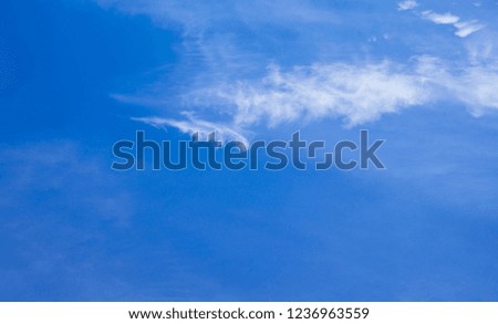 Partly cloudy sky, beautiful light and soft puffy white clouds and blue sky with space for product montage, writing wallpaper, website backdrop template. Abstract and nature background