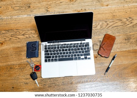 Laptop and other accessories on the desk