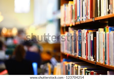 Books in public library, shallow DOF. Royalty-Free Stock Photo #123704254