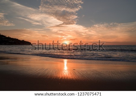 Sunset over the Pacific Ocean in Redondo Beach California.  Golden hour scenic background. Reflection of the sun.