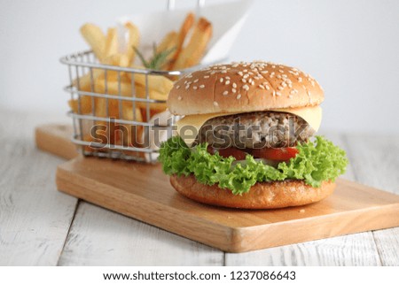 Homemade Cheese Burger and French fries in the Basket 