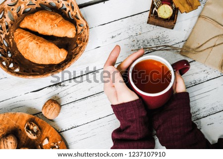 Cup of tea in female hands