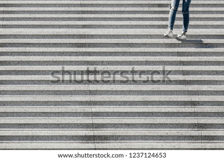 View on stairs in a modern district with a girl. Abstract minimal background.